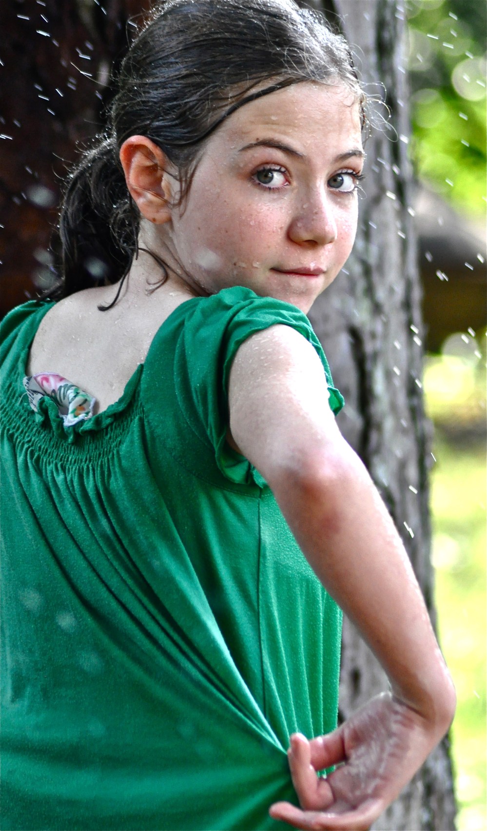 She & her brother were playing in the sprinklers fully dressed