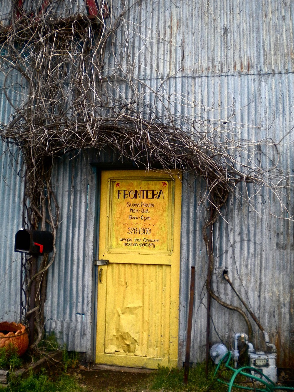 Its the warehouse with the little yellow door, you can't miss it