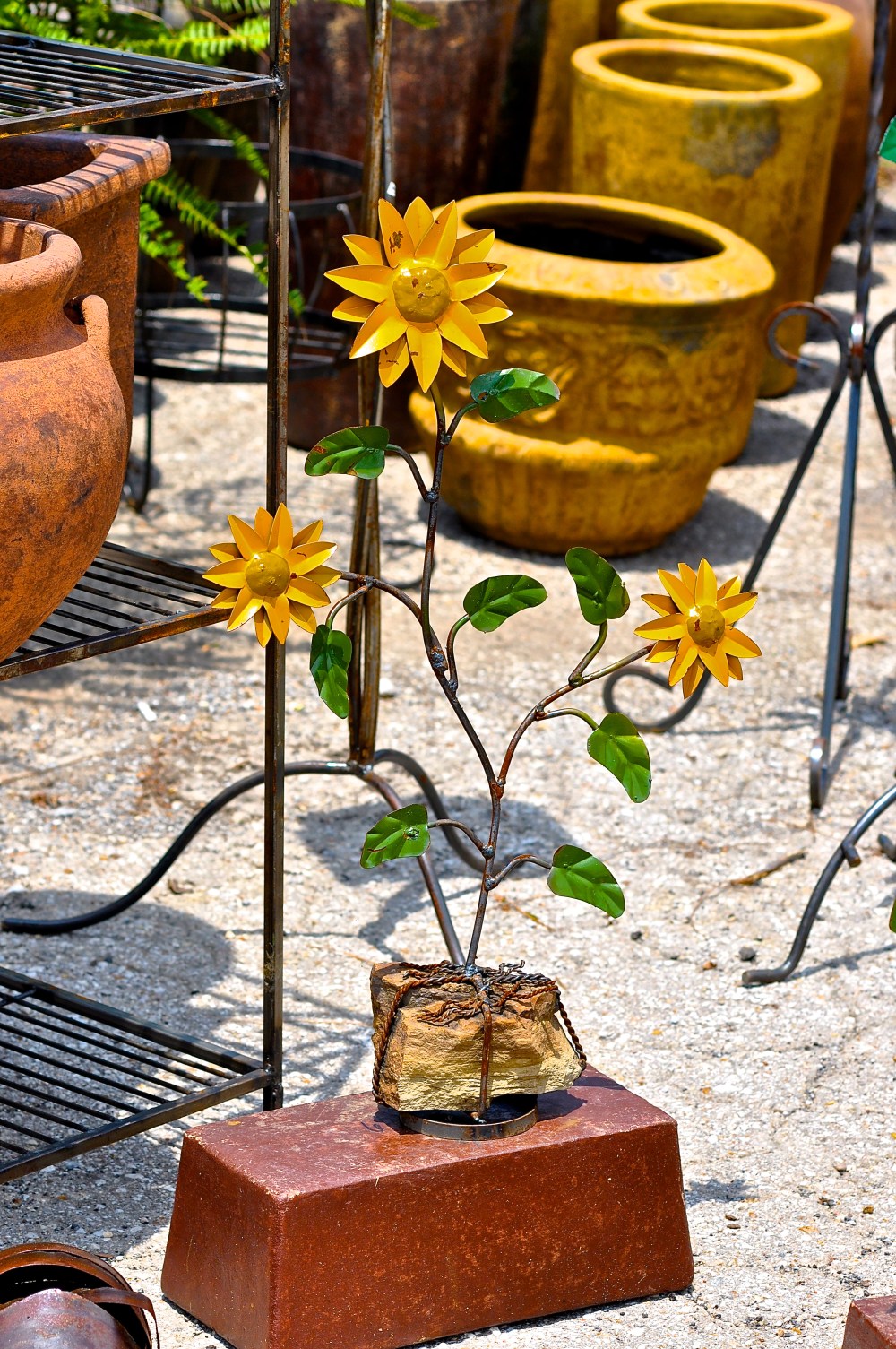 Concrete Sunflowers they grow in a parking lot