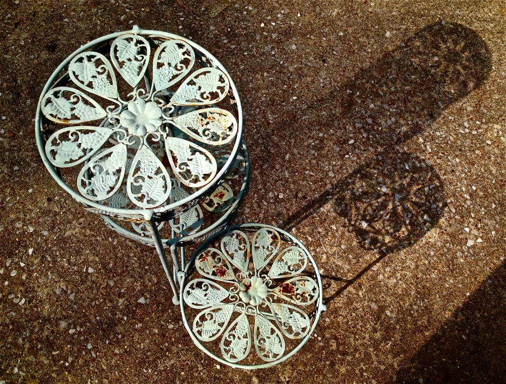 long shadows from an old plant stand