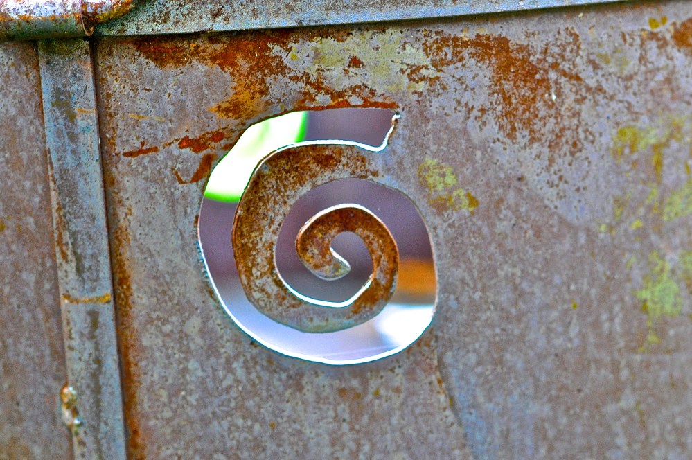 A large tube that someone put a doodle on