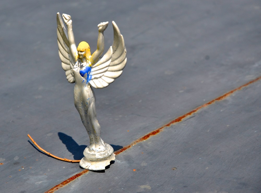 Lady graces an old 1970's Chevy