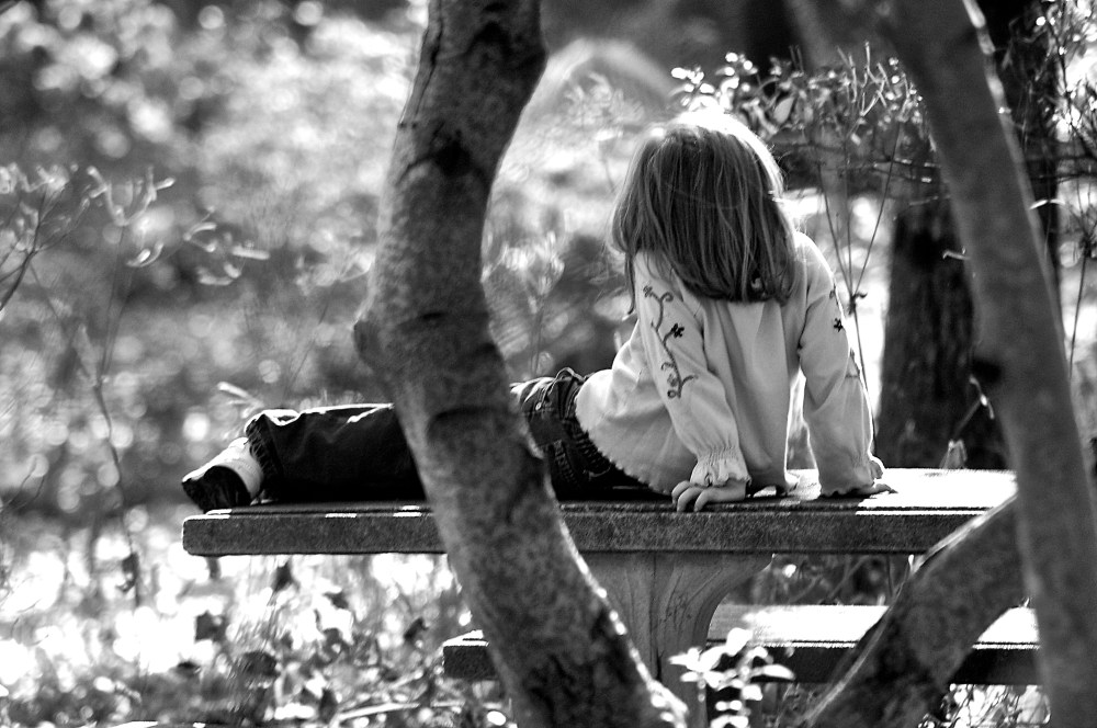 My daughter framed between two trees