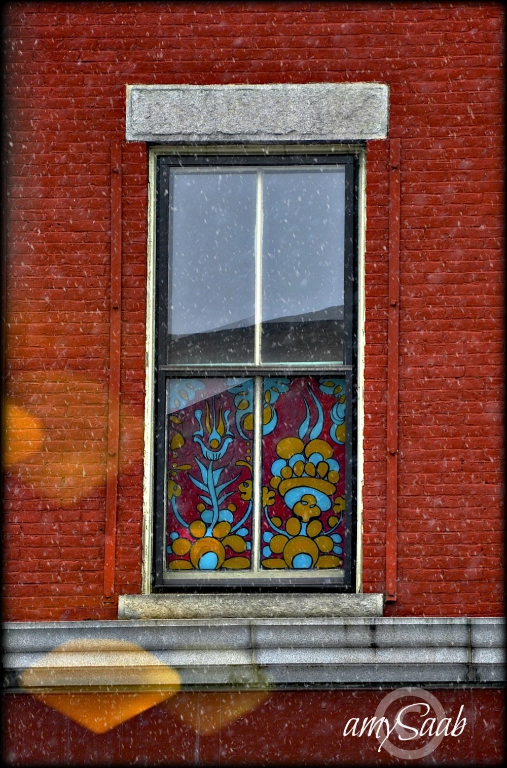 The window curtain across the street