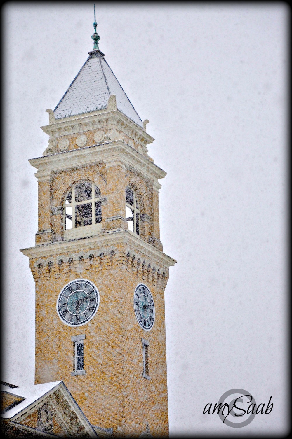 snow covered City Hall clock tower