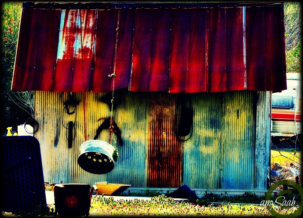 tin house with a steel wheel swing