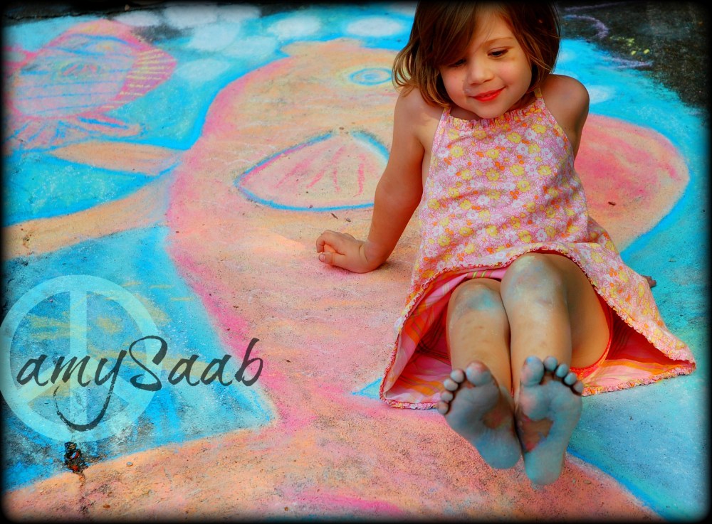 Little girl sits on art & her feet turn blue