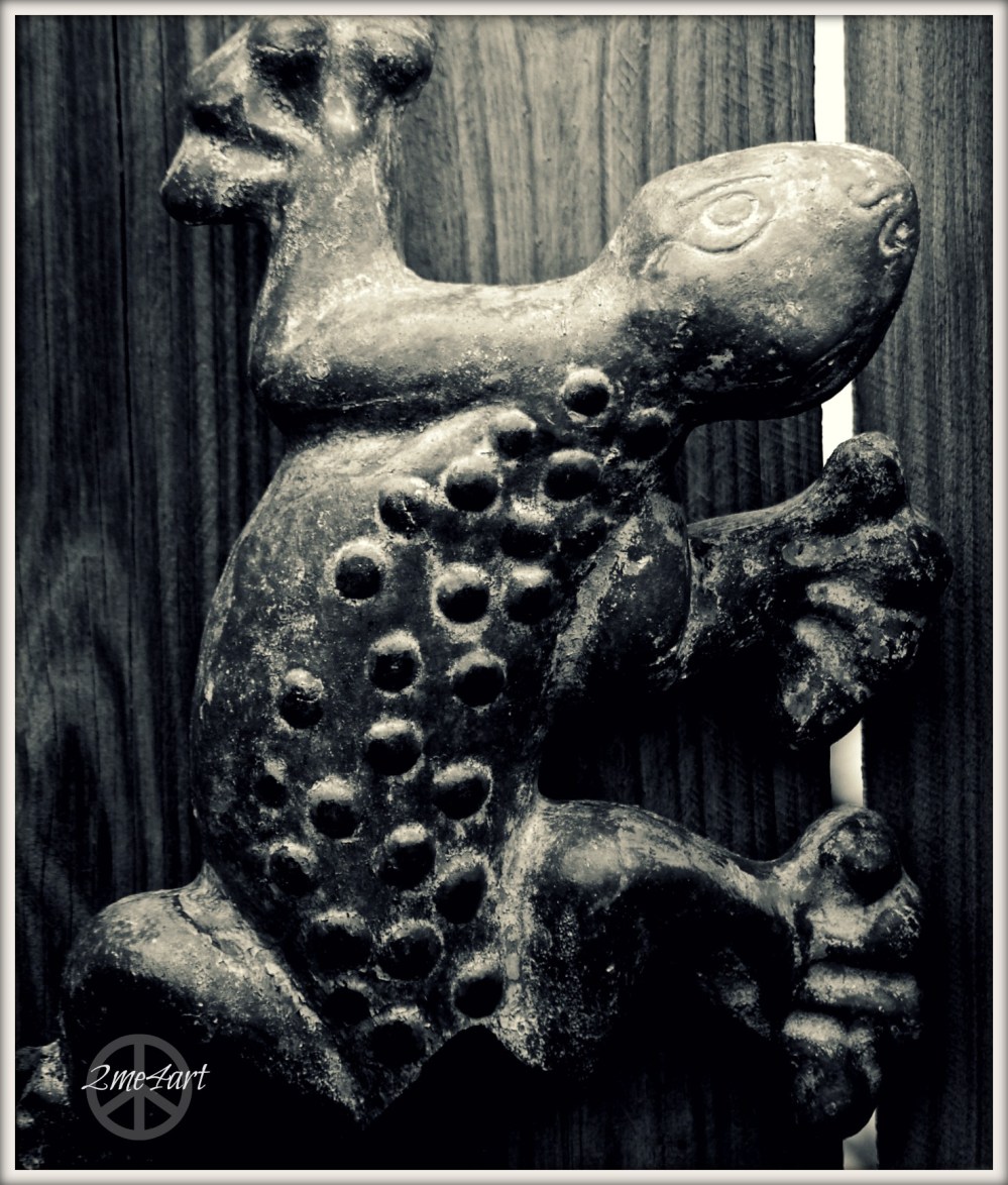 lizard climbing toward the light