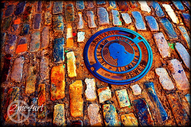 sanitary sewer among the cobble stones