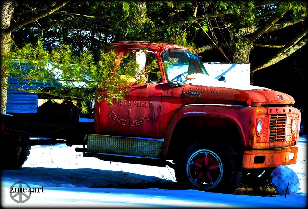 Old fire truck set upon snow. Vermont