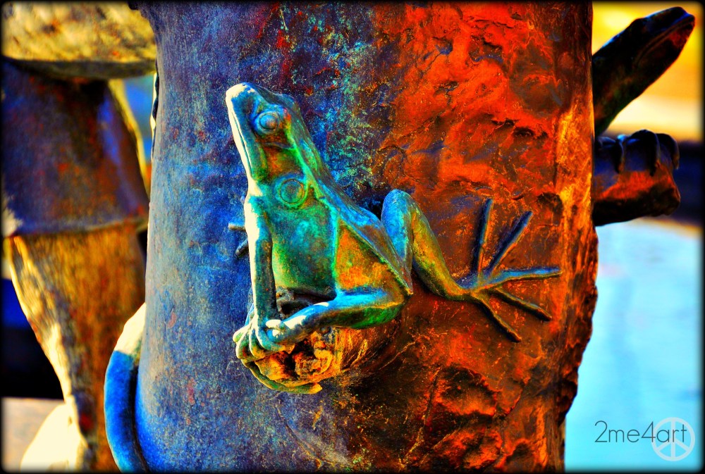 i've been teaching photography to my son & I told him that the sun casts different colors throughout the day (& year) I told him that shadows are blue.  Opposite of blue would be yellow. This bronze statue stands in a fountain in front of the Birmingham United Methodist Church @ 5 points South.  My son hadn't been to this part of town in years & I hadn't realized how sheltered he was.  He had never seen such a grand old church so close or a homeless man sleeping on the grass in the middle of the afternoon…he never saw a fountain with sculpture of animals listening to a ram tell a story.  While I was taking pictures he is looking everywhere at once.  Stunned.  Motorcycles come barreling up the hill, their engines screaming like thunder…the contrasts was hitting my son like hard rain.  I've got to take him out for more adventures to see if he sees differently then me.