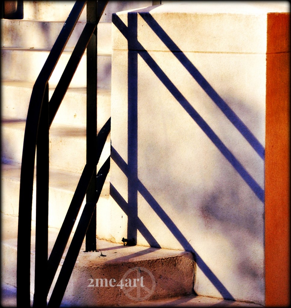 I was with my son & I aimed the camera at these steps & I asked him, "what am I seeing through my lens?" He quickly glances in the general direction of the church & says, "the shadows from the railing on the steps…i see everything like you, Mom." boosts this proud mom. :)