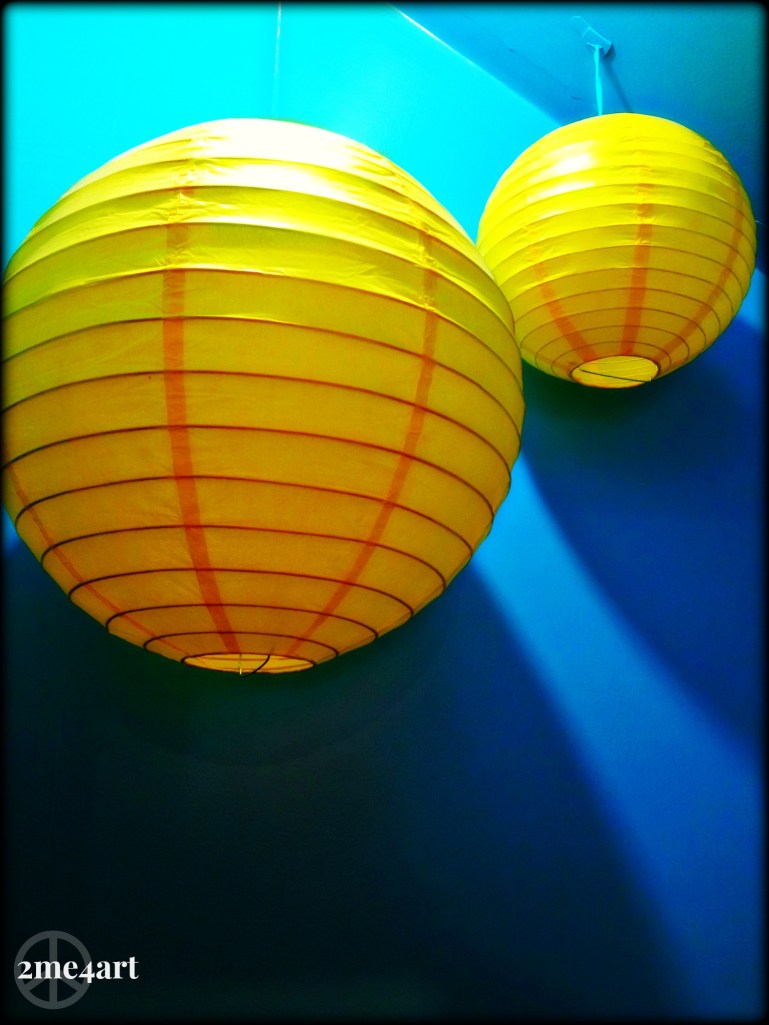 I sat down at a table, with a very good friend, to enjoy a cup of tea.  I'd never been to this coffee/book store before.  It used to be a Starbucks, but was now a privately owned establishment.  I support the privately owned as much as I can, bravo to their courage.  Behind my friend was this sight…a little blue closet filled with yellow lanterns.  For those who live in Birmingham,  the coffee shop is called,  Church Street & books, located in Crestline Village.  