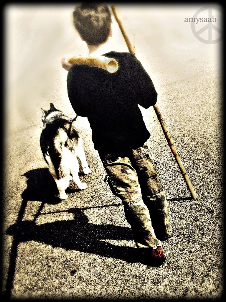 This is my son & Nala. He carried back two large pieces of bamboo. 