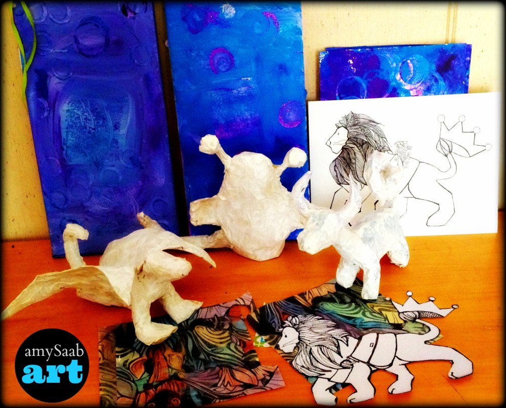 the white animals are incomplete. they are sculpture made from tin foil, masking tape & painted with gesso. the tall blue/purple paintings are a base for a collage to come. Lions are based on Zendoodle idea…Zebra's are going on collage.