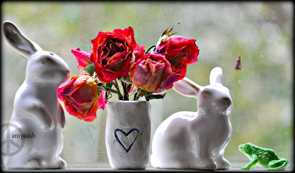 I made the wee vase. those are roses I dried on the windowsill. Rabbits for Easter (my husband) & frogs for Passover…although only one frog can be seen here. Hard to catch those frogs