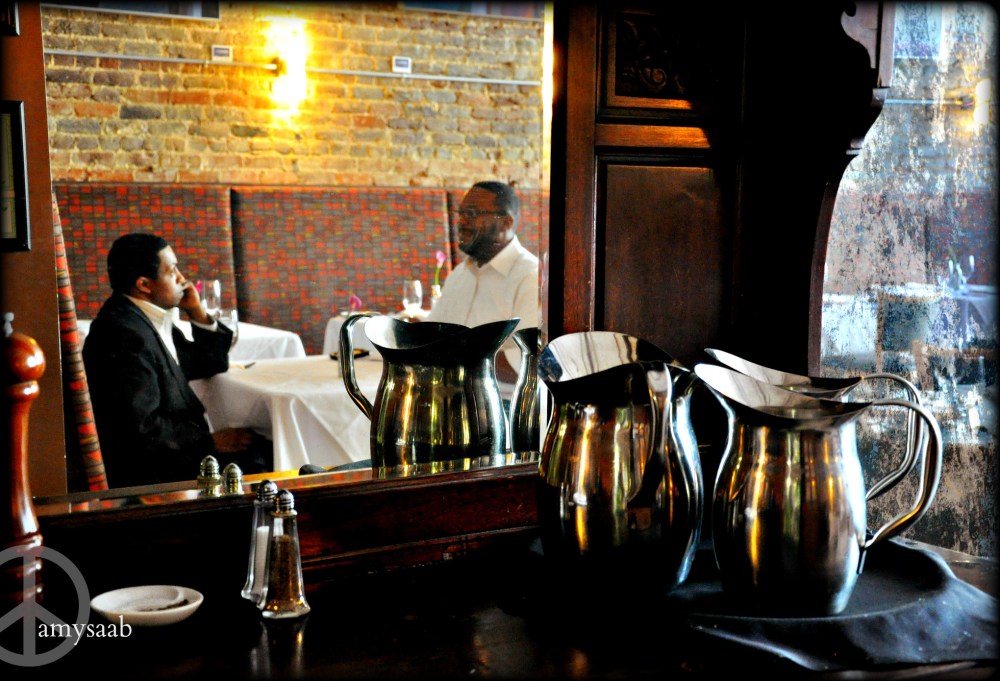 Two very nice gentleman gave me permission to photograph their reflection in this antique dresser mirror.  