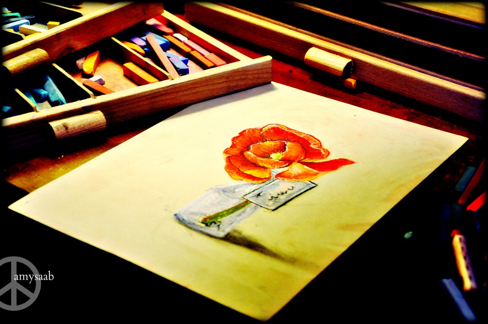 Today I made this. It took about an hour. It is the first time in about 5 years or so that I've made a soft pastel drawing.  I was scared that I wouldn't feel drawn (pun intended) to the piece because I was afraid of the blank piece of paper. I have a silk red poppy in a very tiny vase. Looks just like this. I'm going to do a little art everyday. I hope. 