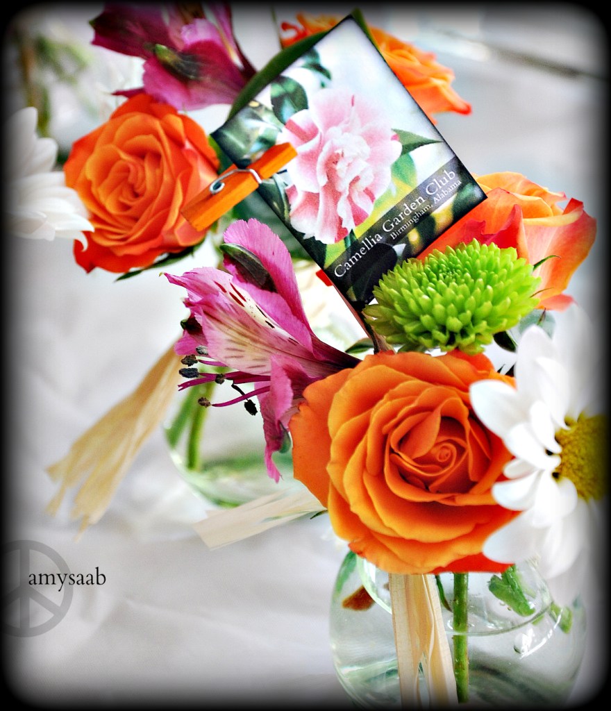 These are the small bouquets with the small photos for the tables. The vases with flowers stood about 5" tall.  